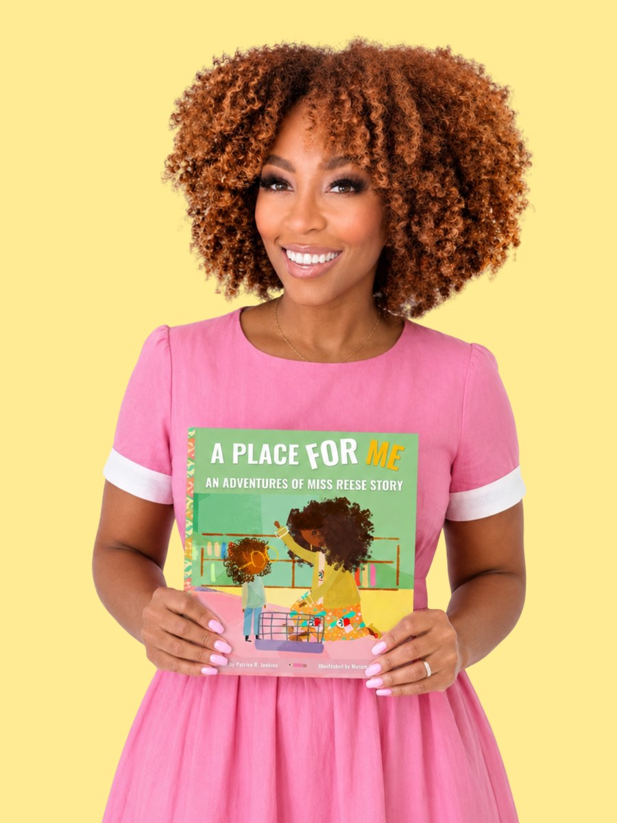 Patrice R. Jenkins holding her picture book A Place for Me